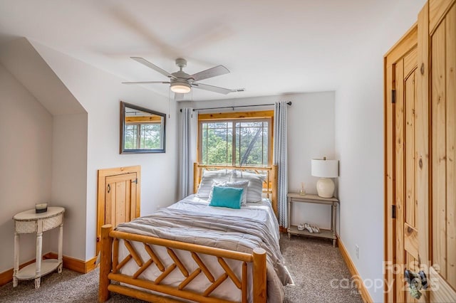 carpeted bedroom with baseboards and a ceiling fan