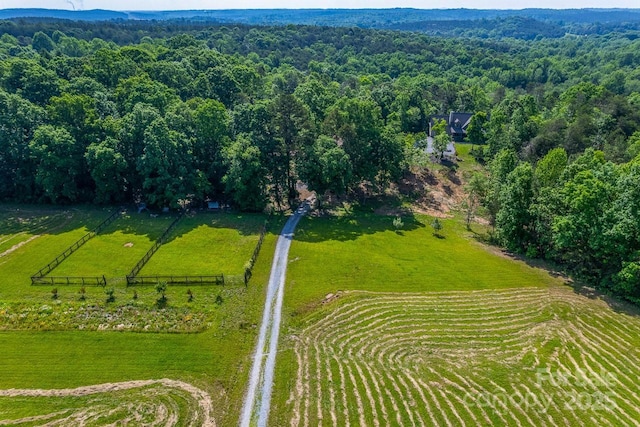 aerial view of sparsely populated area featuring a forest