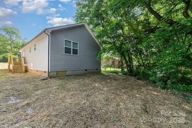 view of property exterior featuring crawl space