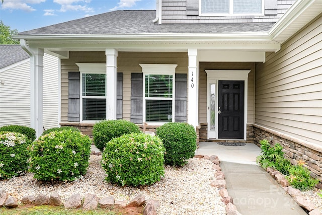 140 Wintergreen Ct, Lexington, NC 27295 - property entrance with a shingled roof, covered porch, and stone siding