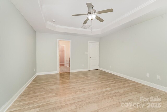140 Wintergreen Ct, Lexington, NC 27295 - unfurnished room featuring a raised ceiling, light wood-style flooring, crown molding, baseboards, and ceiling fan