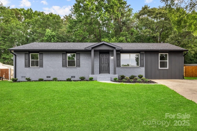 316 Fulton St, Kings Mountain, NC 28086 - single story home featuring crawl space, roof with shingles, board and batten siding, brick siding, and view of wooded area