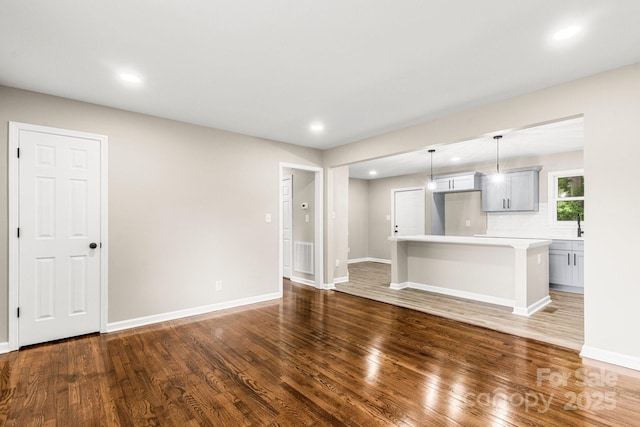 316 Fulton St, Kings Mountain, NC 28086 - unfurnished living room with wood finished floors, recessed lighting, and baseboards