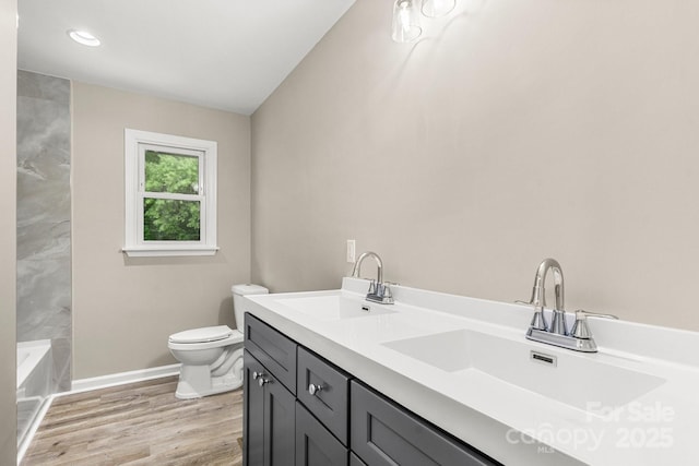 316 Fulton St, Kings Mountain, NC 28086 - full bathroom with toilet, baseboards, double vanity, wood finished floors, and a bath