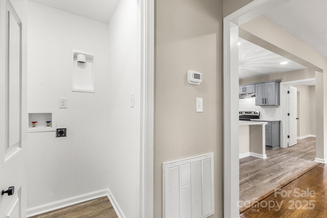 316 Fulton St, Kings Mountain, NC 28086 - laundry area featuring electric dryer hookup, washer hookup, wood finished floors, and baseboards