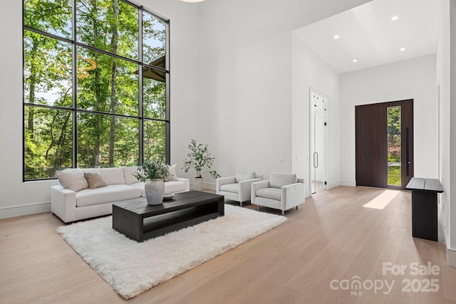 78 Running Creek Trl Unit 93, Arden, NC 28704 - living area featuring a high ceiling, baseboards, light wood finished floors, and recessed lighting