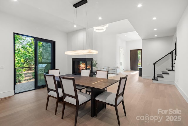 78 Running Creek Trl Unit 93, Arden, NC 28704 - dining space with a large fireplace, light wood-type flooring, plenty of natural light, recessed lighting, and baseboards