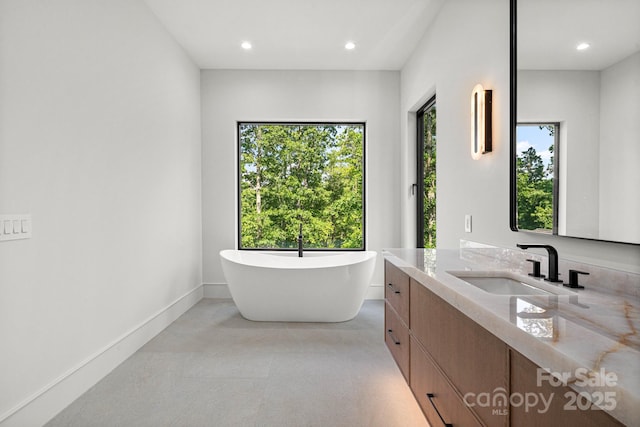 78 Running Creek Trl Unit 93, Arden, NC 28704 - bathroom featuring vanity, a freestanding bath, recessed lighting, and baseboards