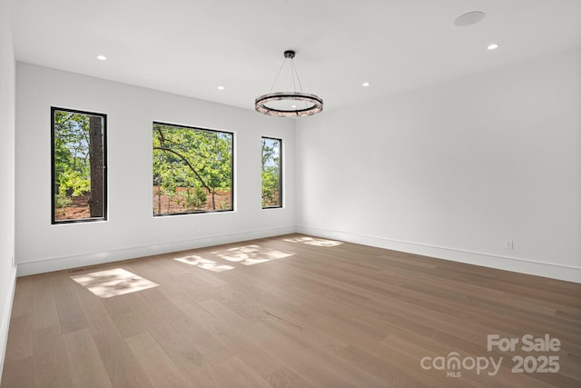 78 Running Creek Trl Unit 93, Arden, NC 28704 - empty room with wood finished floors, baseboards, recessed lighting, and a chandelier