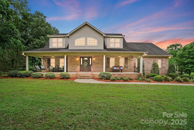 803 Freeman Rd, Concord, NC 28025 - traditional home with covered porch, brick siding, and a front yard