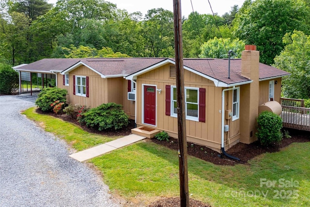 428 Jackson Rd, Fletcher, NC 28732 - view of front of house with a chimney, roof with shingles, a front lawn, and gravel driveway
