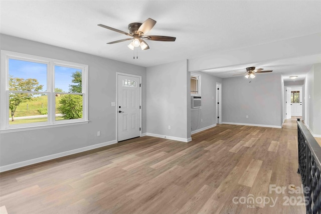 428 Jackson Rd, Fletcher, NC 28732 - foyer entrance featuring a ceiling fan, light wood-style flooring, and baseboards