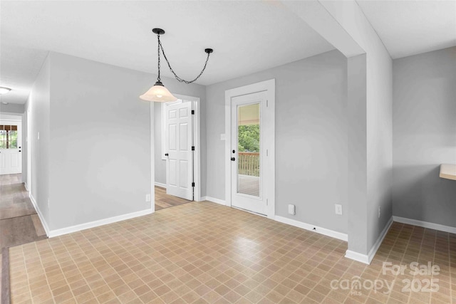 428 Jackson Rd, Fletcher, NC 28732 - unfurnished dining area with baseboards