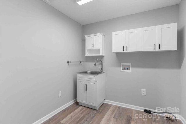 428 Jackson Rd, Fletcher, NC 28732 - washroom featuring hookup for a washing machine, wood finished floors, baseboards, and cabinet space