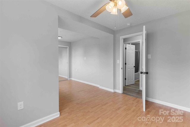 428 Jackson Rd, Fletcher, NC 28732 - empty room with baseboards, a ceiling fan, light wood finished floors, and a smoke detector