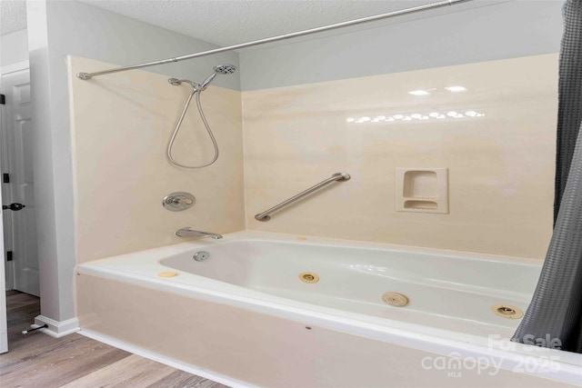428 Jackson Rd, Fletcher, NC 28732 - bathroom featuring a combined bath / shower with jetted tub, wood finished floors, and baseboards