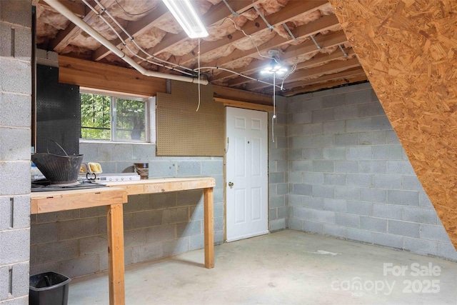 428 Jackson Rd, Fletcher, NC 28732 - basement with a workshop area and concrete block wall