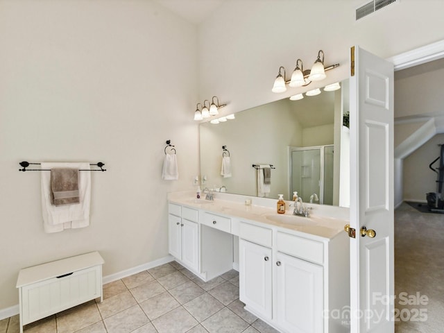 1564 Trippett St NW, Concord, NC 28027 - full bath with double vanity, a shower stall, tile patterned flooring, and baseboards
