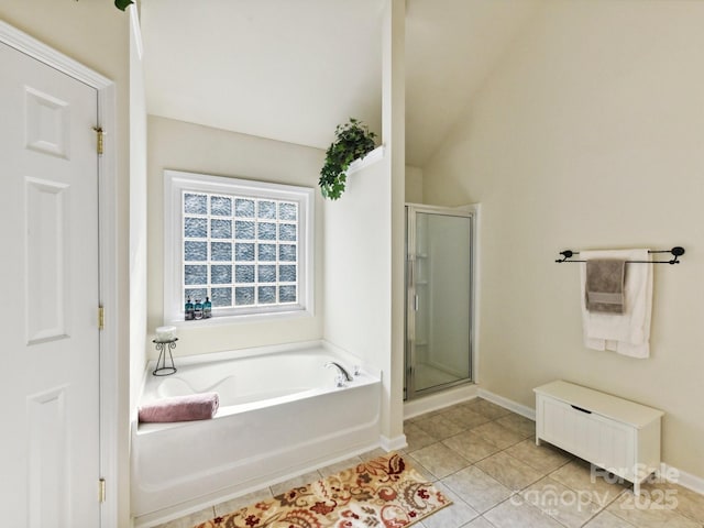 1564 Trippett St NW, Concord, NC 28027 - bathroom with a garden tub, a shower stall, tile patterned floors, baseboards, and lofted ceiling