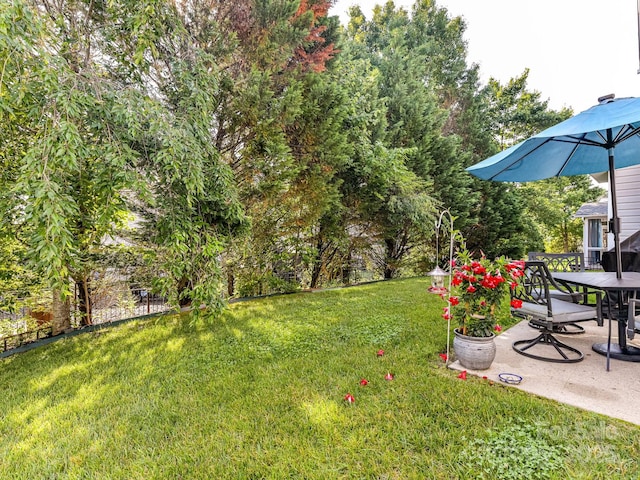 1564 Trippett St NW, Concord, NC 28027 - view of grassy yard with a patio and outdoor dining area