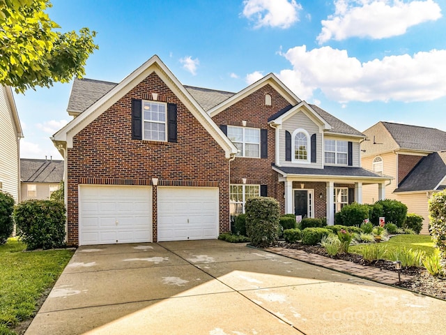 1564 Trippett St NW, Concord, NC 28027 - traditional home with brick siding, an attached garage, concrete driveway, and roof with shingles