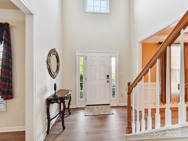 1564 Trippett St NW, Concord, NC 28027 - foyer entrance featuring a towering ceiling, plenty of natural light, wood finished floors, stairway, and baseboards