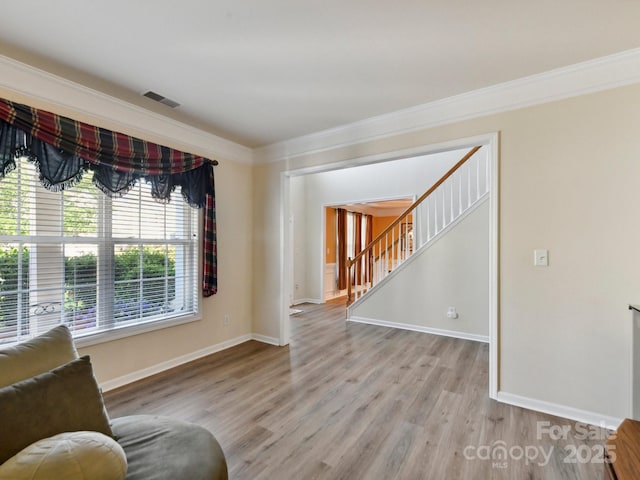 1564 Trippett St NW, Concord, NC 28027 - sitting room featuring ornamental molding, light wood-style floors, baseboards, and stairs