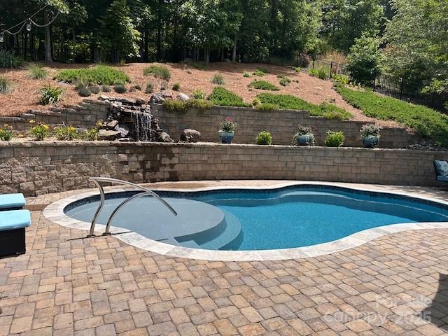 10800 Alabaster Dr, Davidson, NC 28036 - view of swimming pool with a patio area