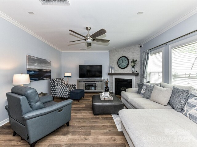10800 Alabaster Dr, Davidson, NC 28036 - living room featuring crown molding, wood finished floors, ceiling fan, a fireplace, and baseboards