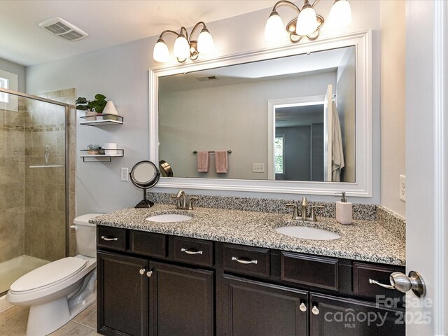 10800 Alabaster Dr, Davidson, NC 28036 - full bathroom featuring double vanity, toilet, a stall shower, tile patterned floors, and healthy amount of natural light