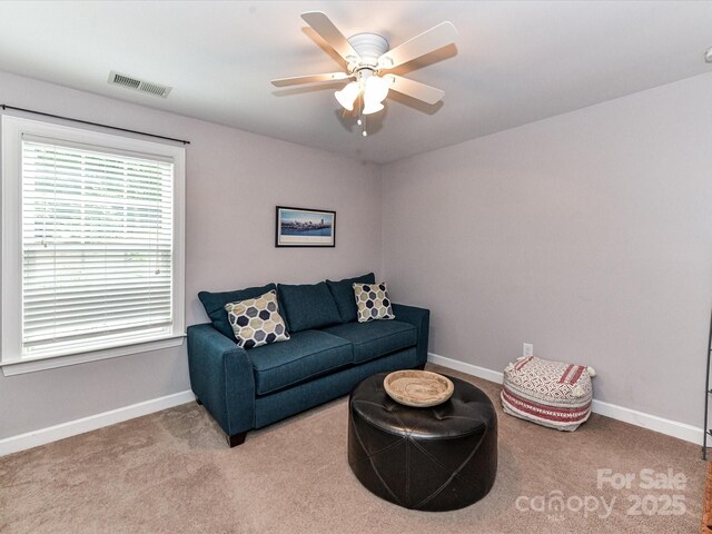 10800 Alabaster Dr, Davidson, NC 28036 - carpeted living room with baseboards and ceiling fan