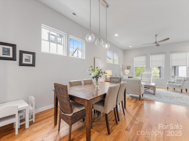 dining area featuring a ceiling fan, light wood finished floors, baseboards, and recessed lighting