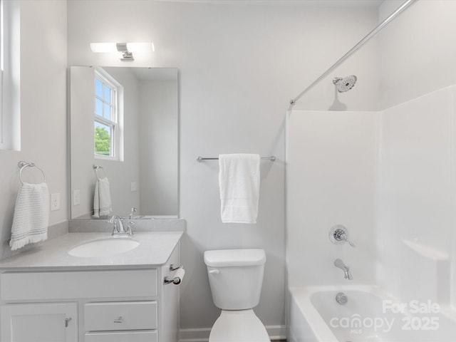 bathroom with shower / washtub combination, vanity, and toilet