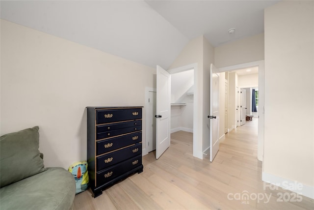 204 Maple Ave, Marion, NC 28752 - sitting room featuring light wood finished floors, lofted ceiling, and baseboards