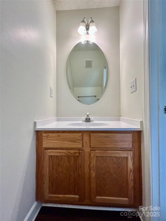 710 Woodington Ln, Charlotte, NC 28214 - bathroom with vanity and baseboards