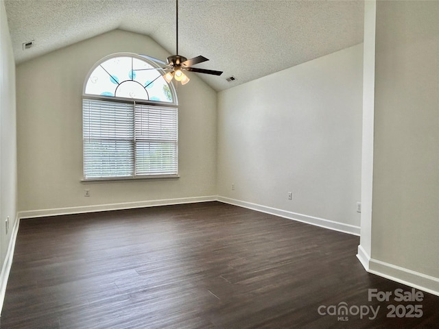 710 Woodington Ln, Charlotte, NC 28214 - spare room featuring ceiling fan, vaulted ceiling, dark wood-type flooring, a textured ceiling, and baseboards