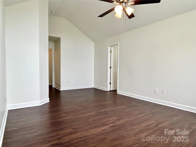 710 Woodington Ln, Charlotte, NC 28214 - spare room with lofted ceiling, a ceiling fan, dark wood-style flooring, and baseboards