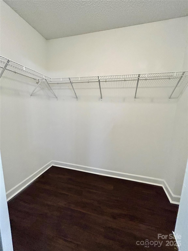 710 Woodington Ln, Charlotte, NC 28214 - spacious closet featuring dark wood-type flooring