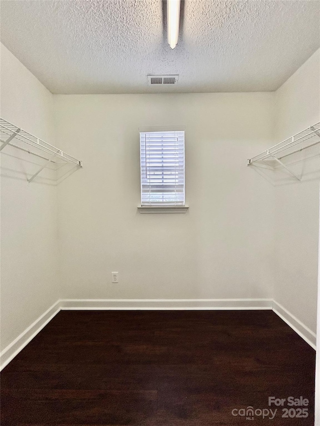 710 Woodington Ln, Charlotte, NC 28214 - spacious closet with dark wood-style flooring