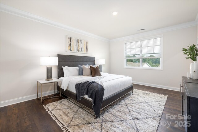 128 S Shayna Rd, Troutman, NC 28166 - bedroom with crown molding, baseboards, and dark wood finished floors
