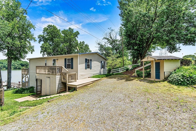 4920 Longfield St, Claremont, NC 28610 - back of house with a deck and an outbuilding