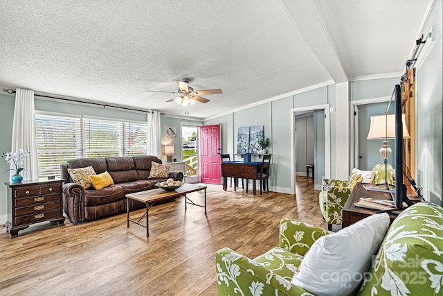 4920 Longfield St, Claremont, NC 28610 - living area featuring crown molding, wood finished floors, a ceiling fan, baseboards, and a textured ceiling