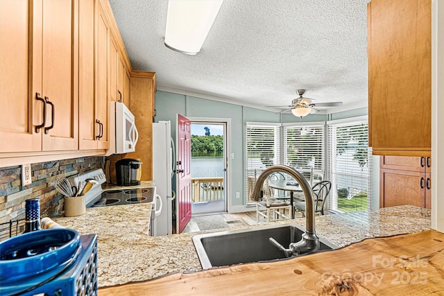 4920 Longfield St, Claremont, NC 28610 - kitchen featuring white appliances, light countertops, a sink, a textured ceiling, and ceiling fan