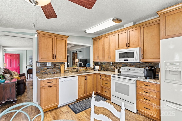 4920 Longfield St, Claremont, NC 28610 - kitchen with white appliances, a sink, a textured ceiling, light wood finished floors, and ceiling fan