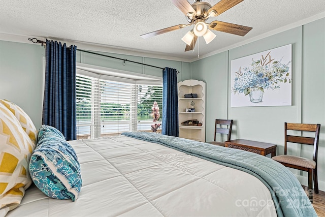 4920 Longfield St, Claremont, NC 28610 - bedroom with a textured ceiling, a ceiling fan, crown molding, and wood finished floors
