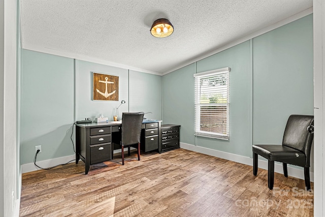 4920 Longfield St, Claremont, NC 28610 - home office with a textured ceiling, light wood-type flooring, and baseboards