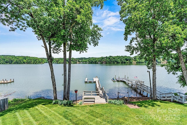 4920 Longfield St, Claremont, NC 28610 - dock featuring a water view and a lawn