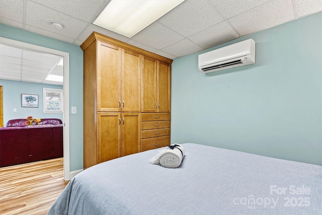 4920 Longfield St, Claremont, NC 28610 - bedroom featuring a paneled ceiling, a wall mounted AC, and wood finished floors