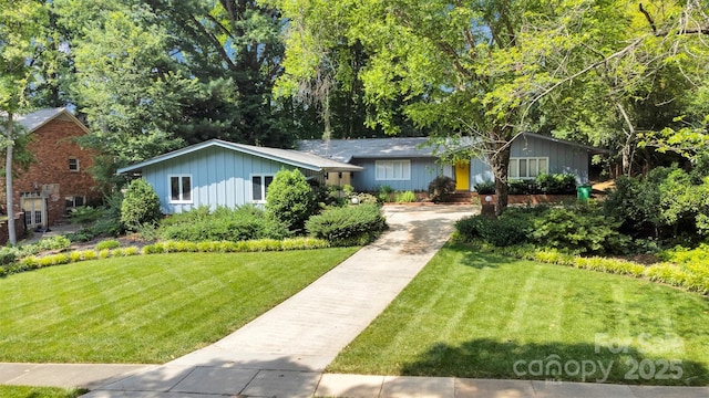 331 Glen Oaks Rd, Charlotte, NC 28270 - ranch-style house featuring concrete driveway, a front lawn, and board and batten siding