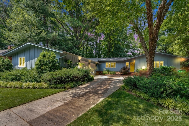 331 Glen Oaks Rd, Charlotte, NC 28270 - view of front of house featuring concrete driveway and board and batten siding